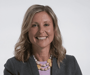 A headshot of Doctor Troxel wearing a business suit.